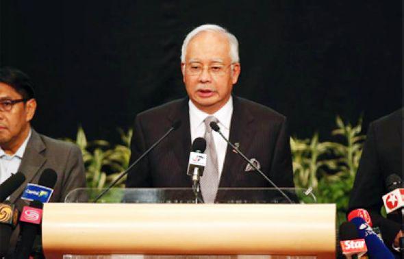 马来西亚总理宣布MH370坠毁。图片来源:和讯网